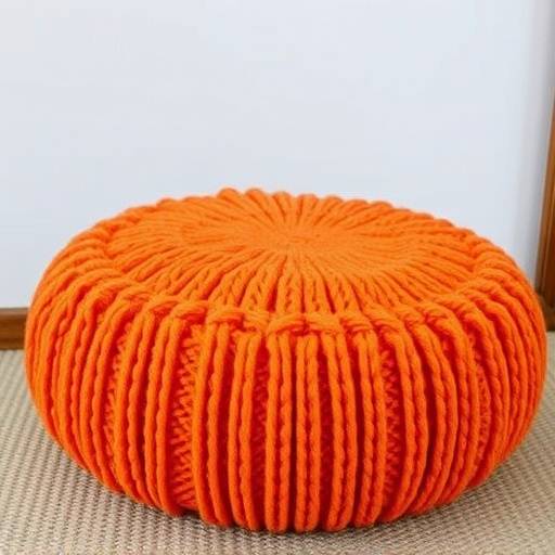 Knitted wool pouf in a bright orange color
